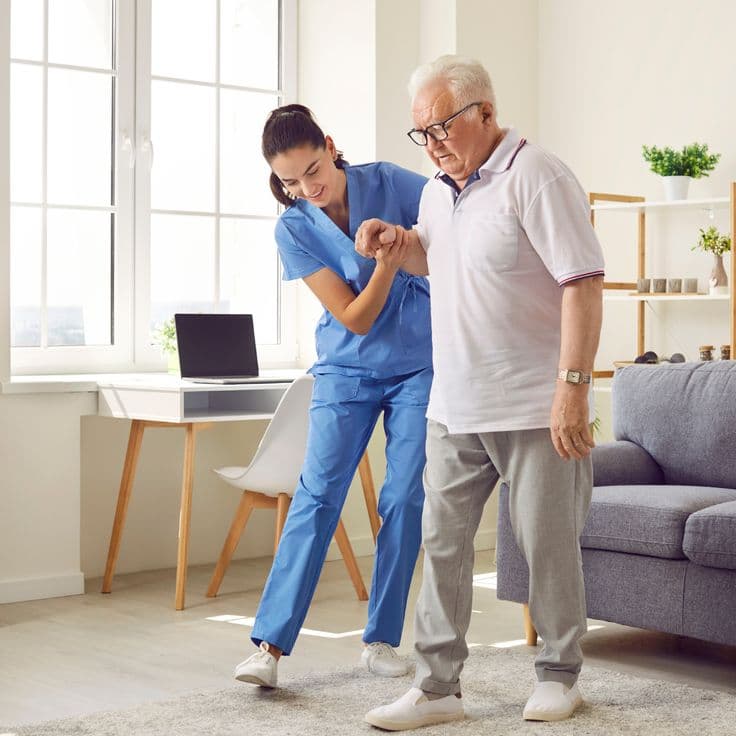 Family member supporting elderly patient's physiotherapy